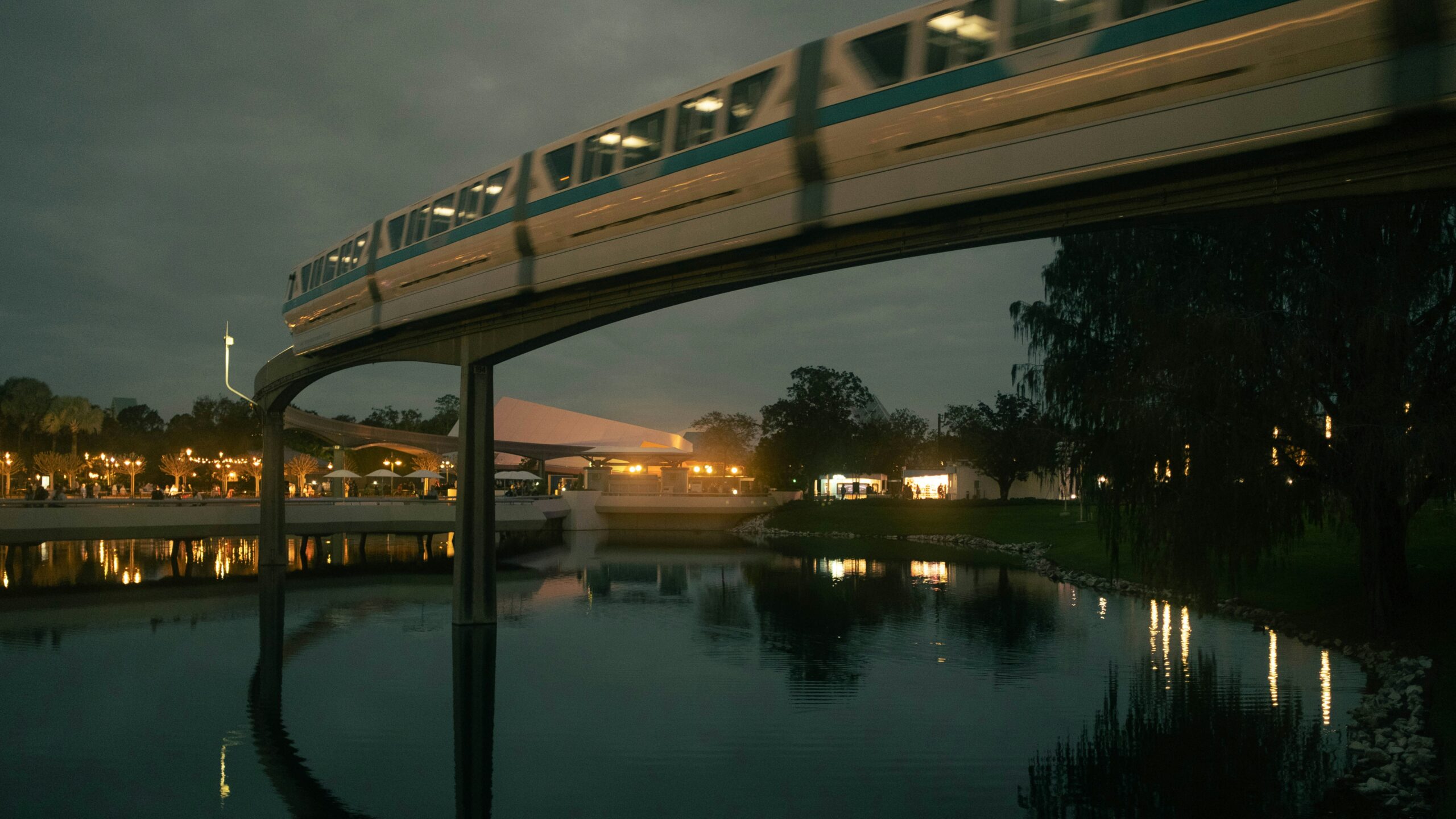 A monorail passing the EPCOT flower beds