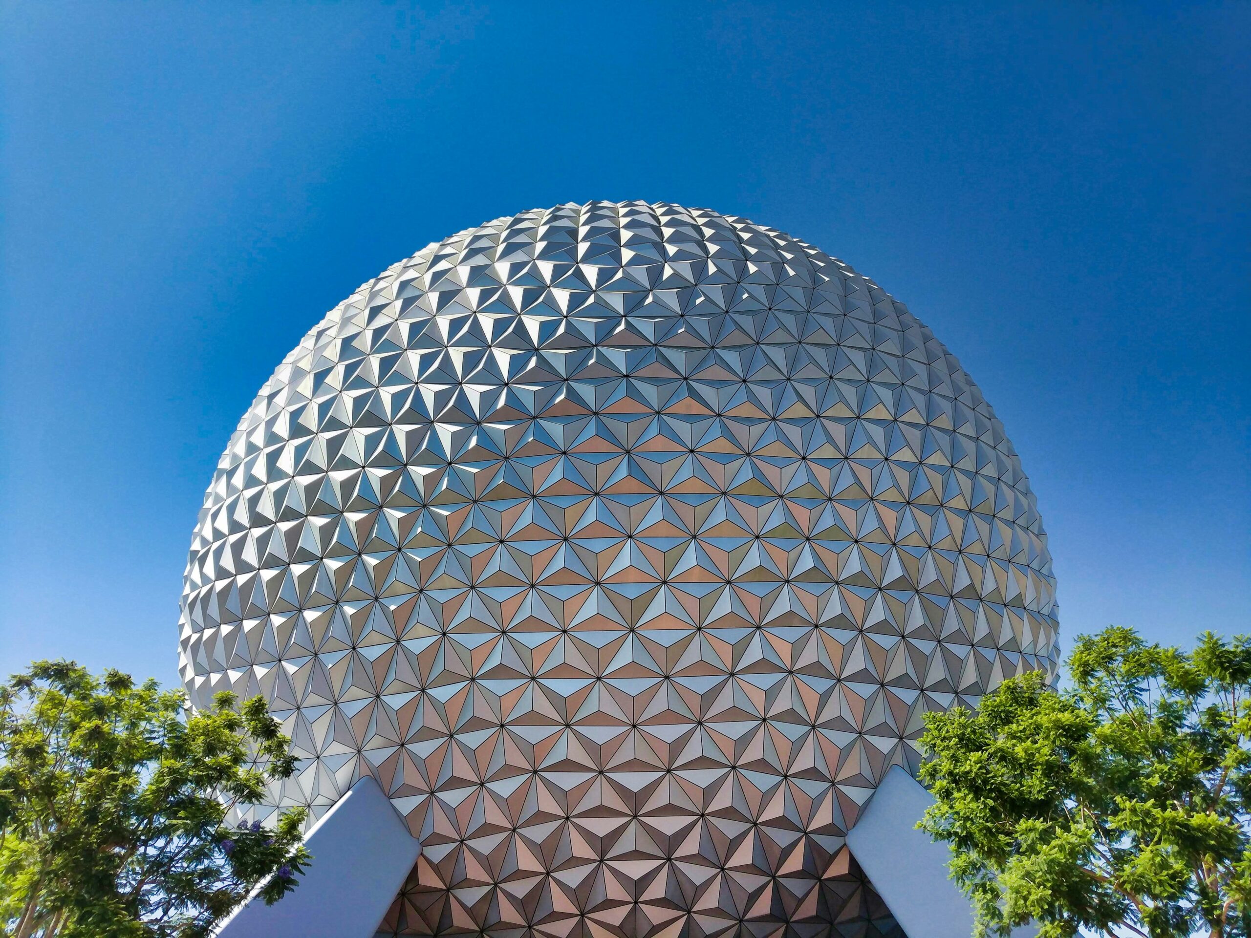 Spaceship Earth against a blue sky at EPCOT