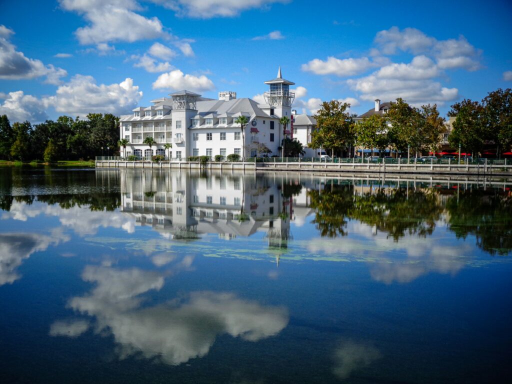 A Disney resort building reflected in the lake
