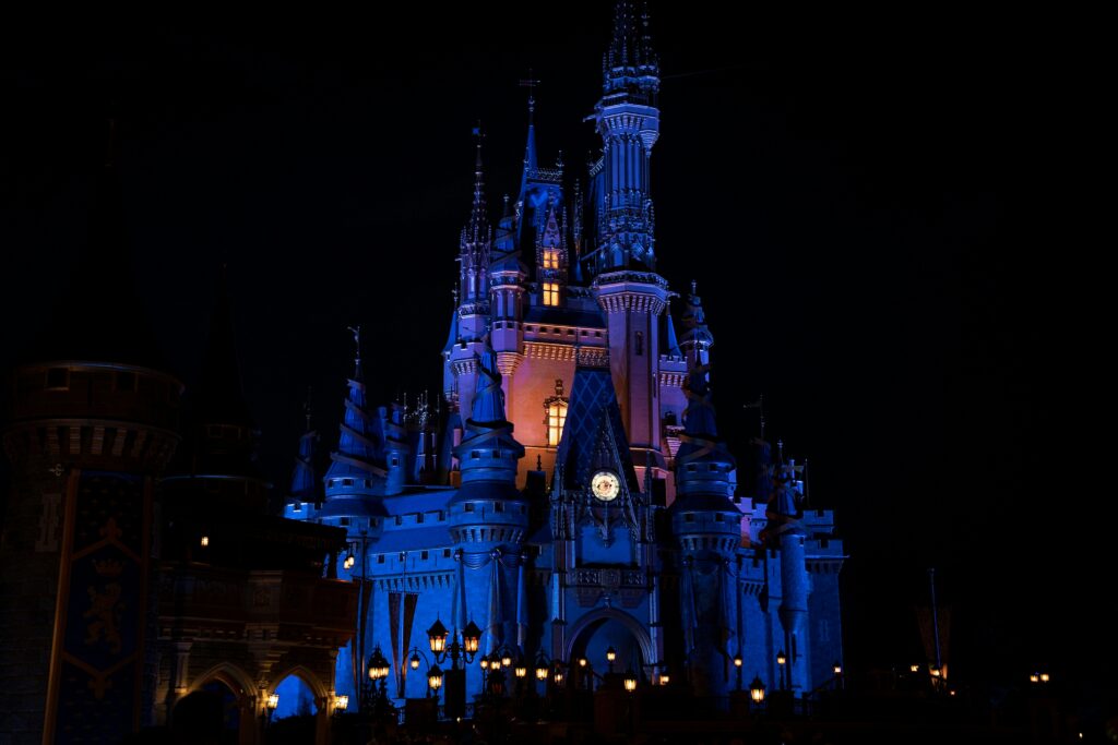 Cinderella Castle lit purple at night, Magic Kingdom